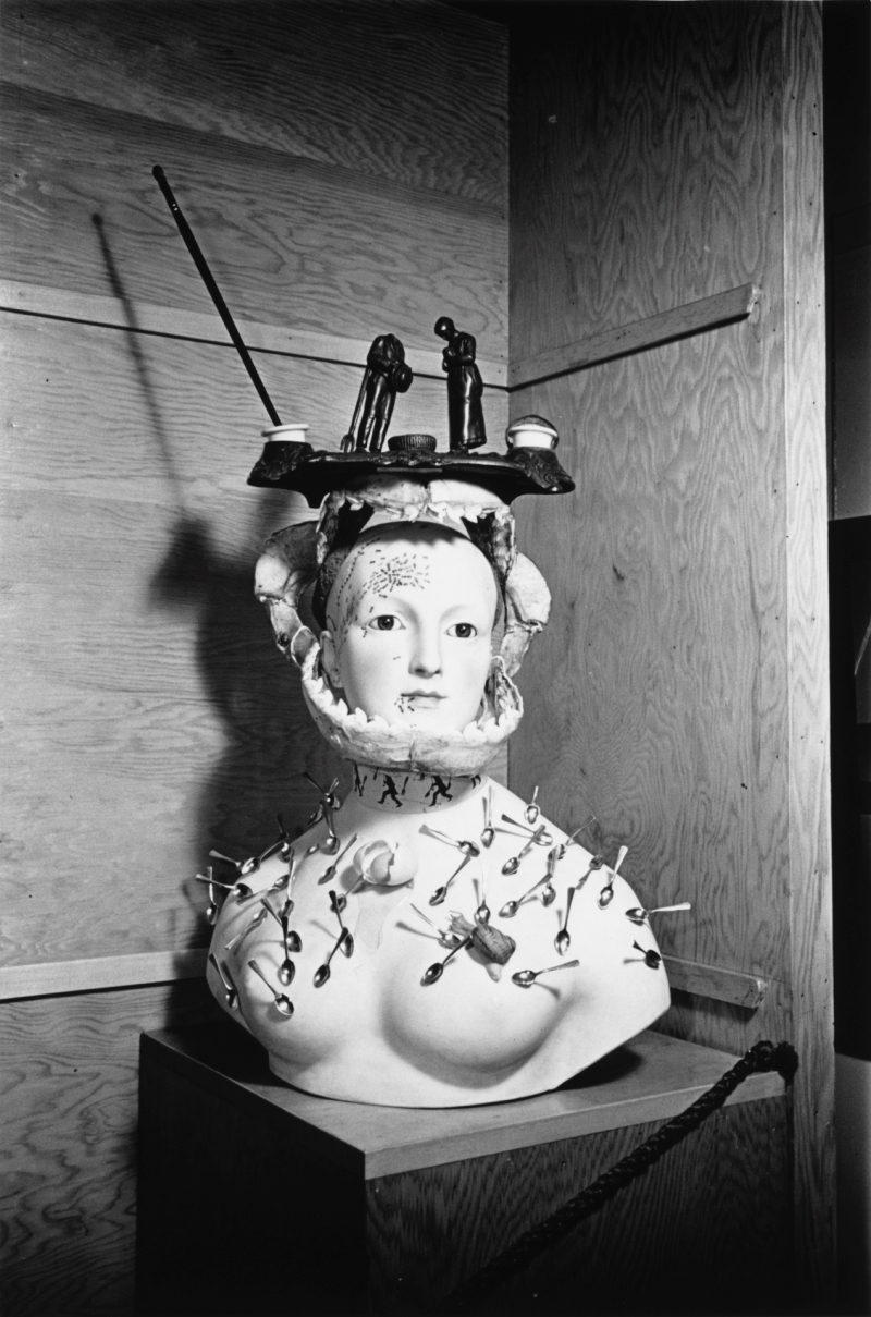 Retrospective Bust of a Woman Devoured by Ants and Spoons